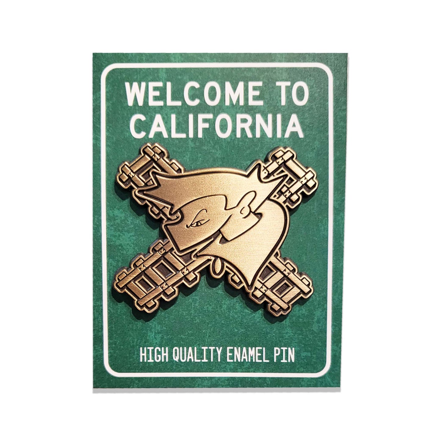 Green california themed card with a black and brushed copper, metallic enamel pin of a graffiti character with train tracks.
