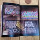 An open magazine, the left and right pages show two photos of graffiti, one on top of the other.