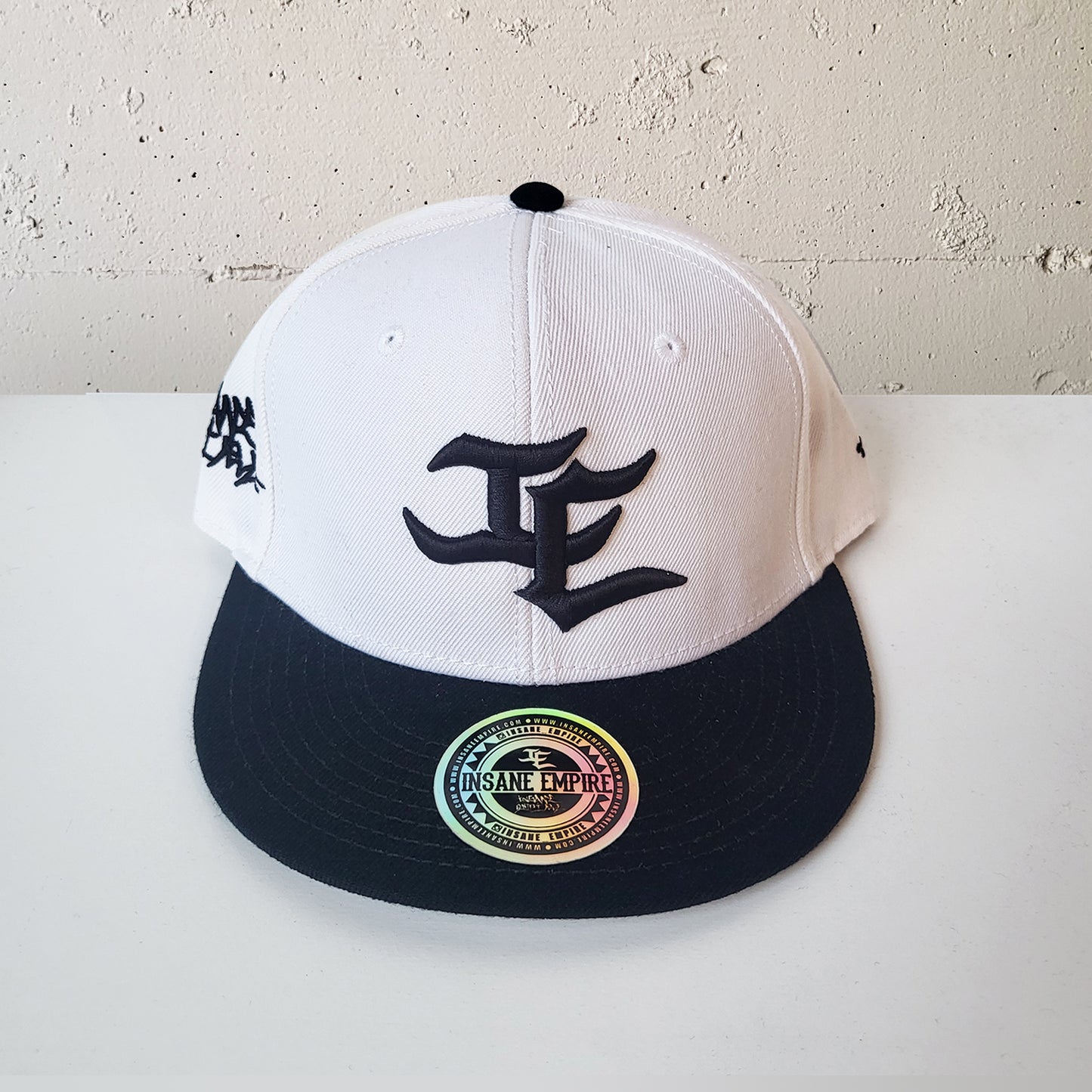 Local artist clothing brand inland empire white and black snap back
