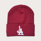 Locally owned graffiti brand Phatcaps, woven light burgundy beanies with white puff embroidery.
