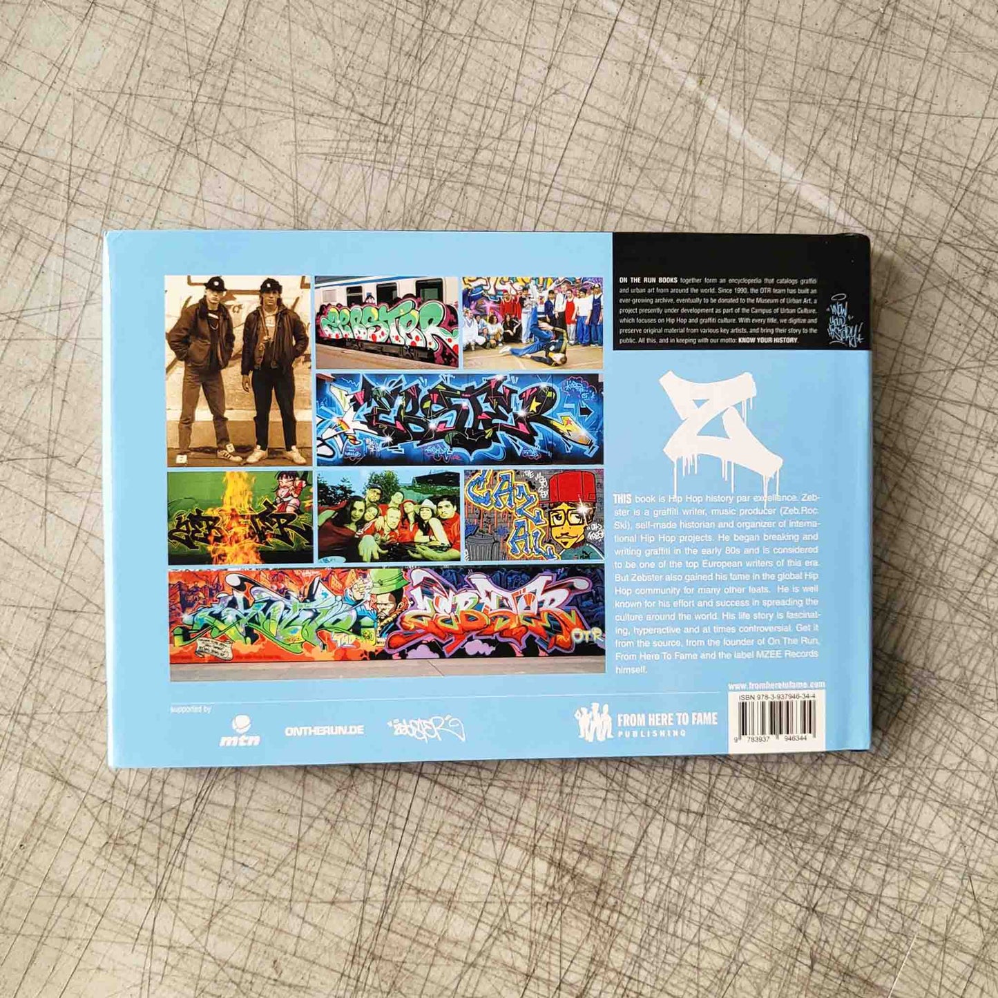 Back cover of a book with images of graffiti and text on a textured surface