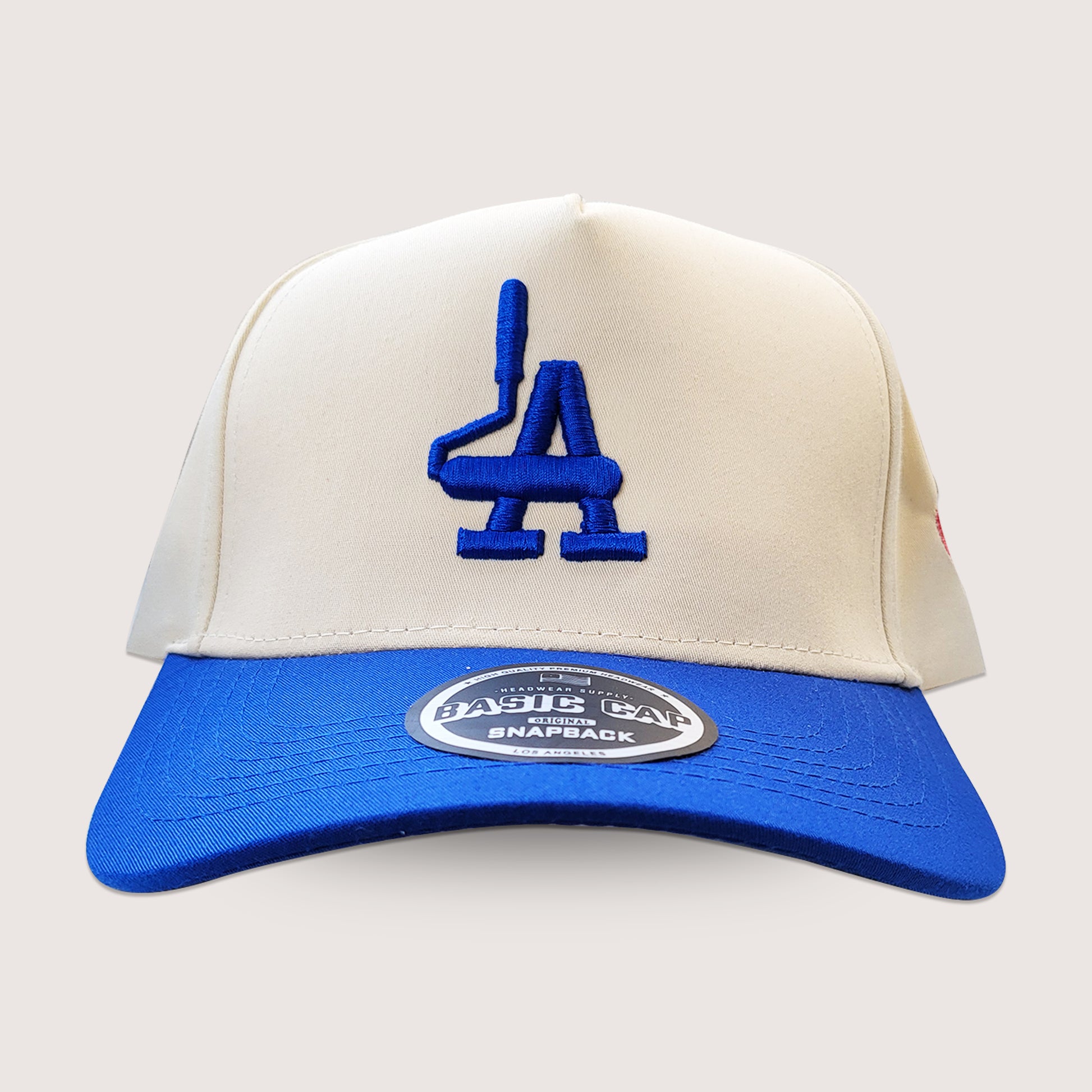 Phatcaps brand cream baseball cap with dodger blue embroidery.
