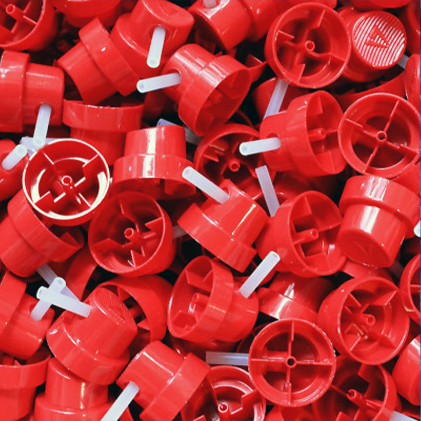 multiple red needle caps