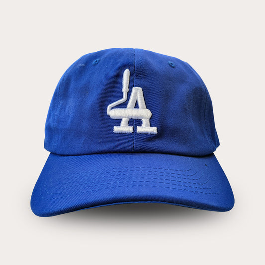 Locally branded unstructured cap in dodger blue with white puff embroidery detail.