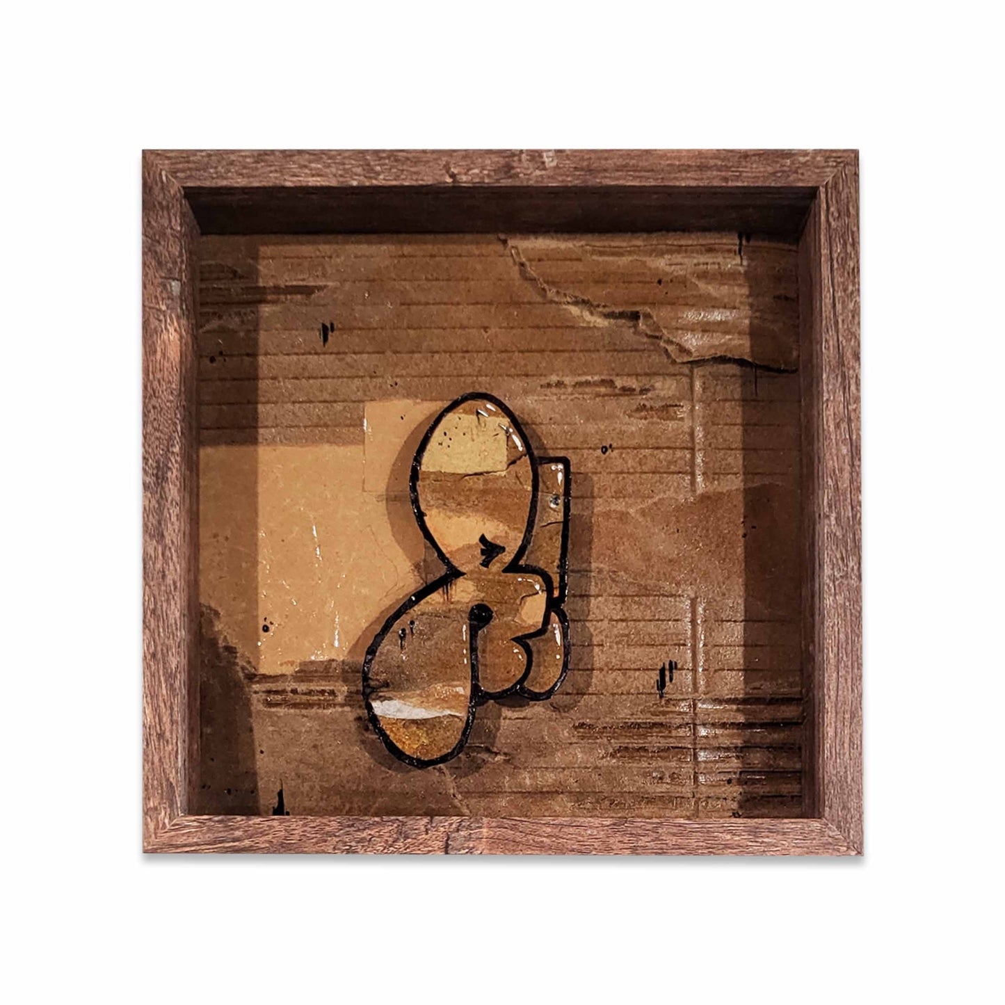 Wooden framed cardboard collage with a graffiti bubble style letter.