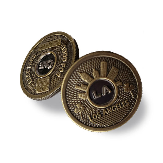 black and gold Gaso token pin 