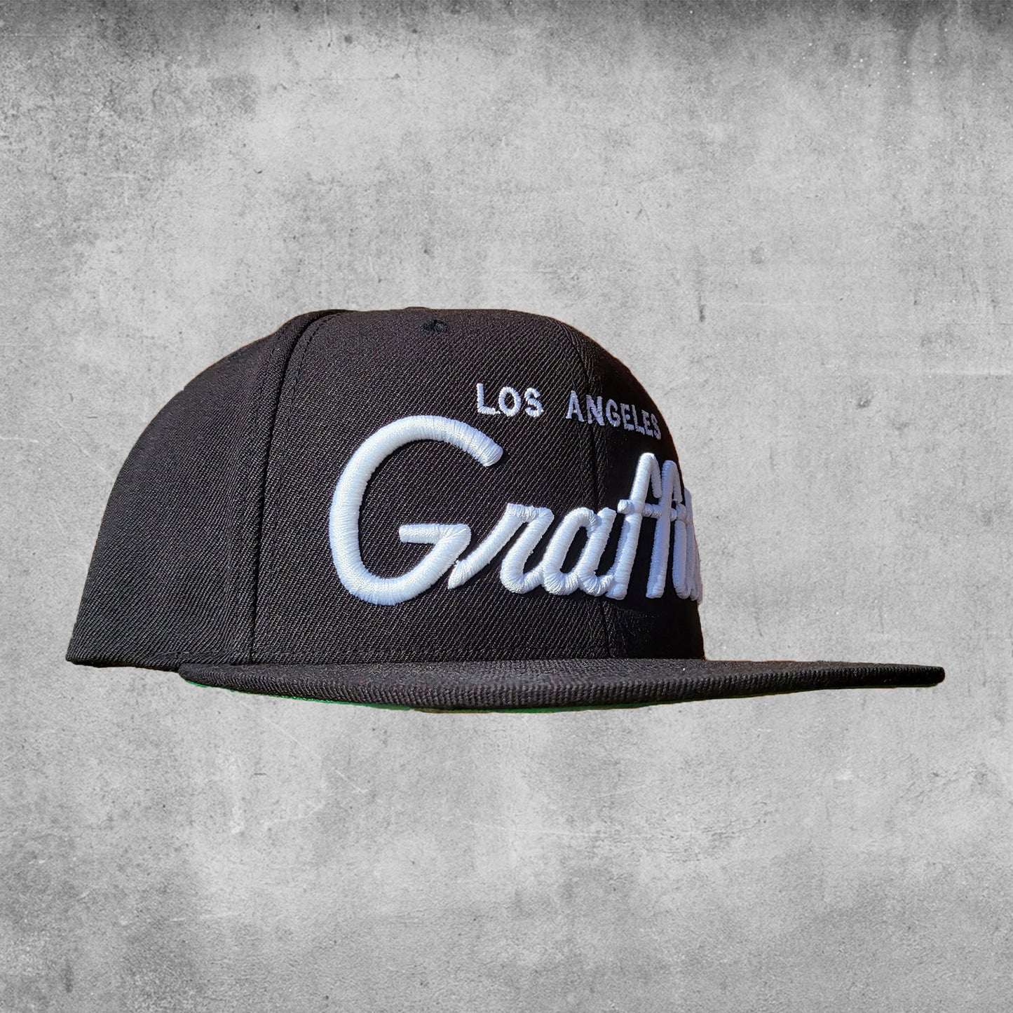 black cap with "los Angeles Graffiti" embroidered in white