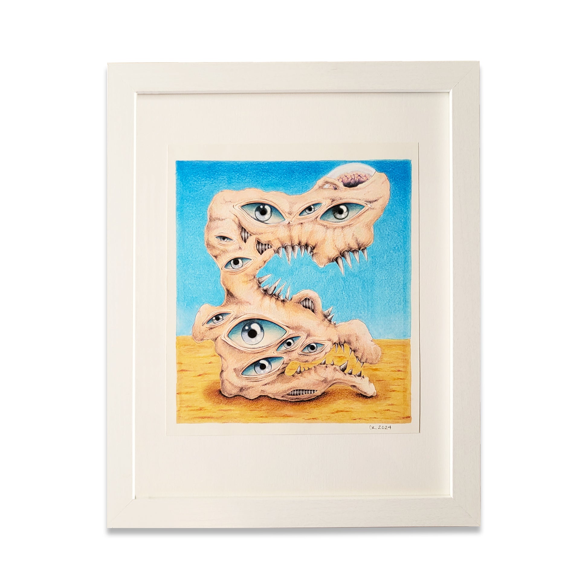 White picture frame with creature with eyes on paper