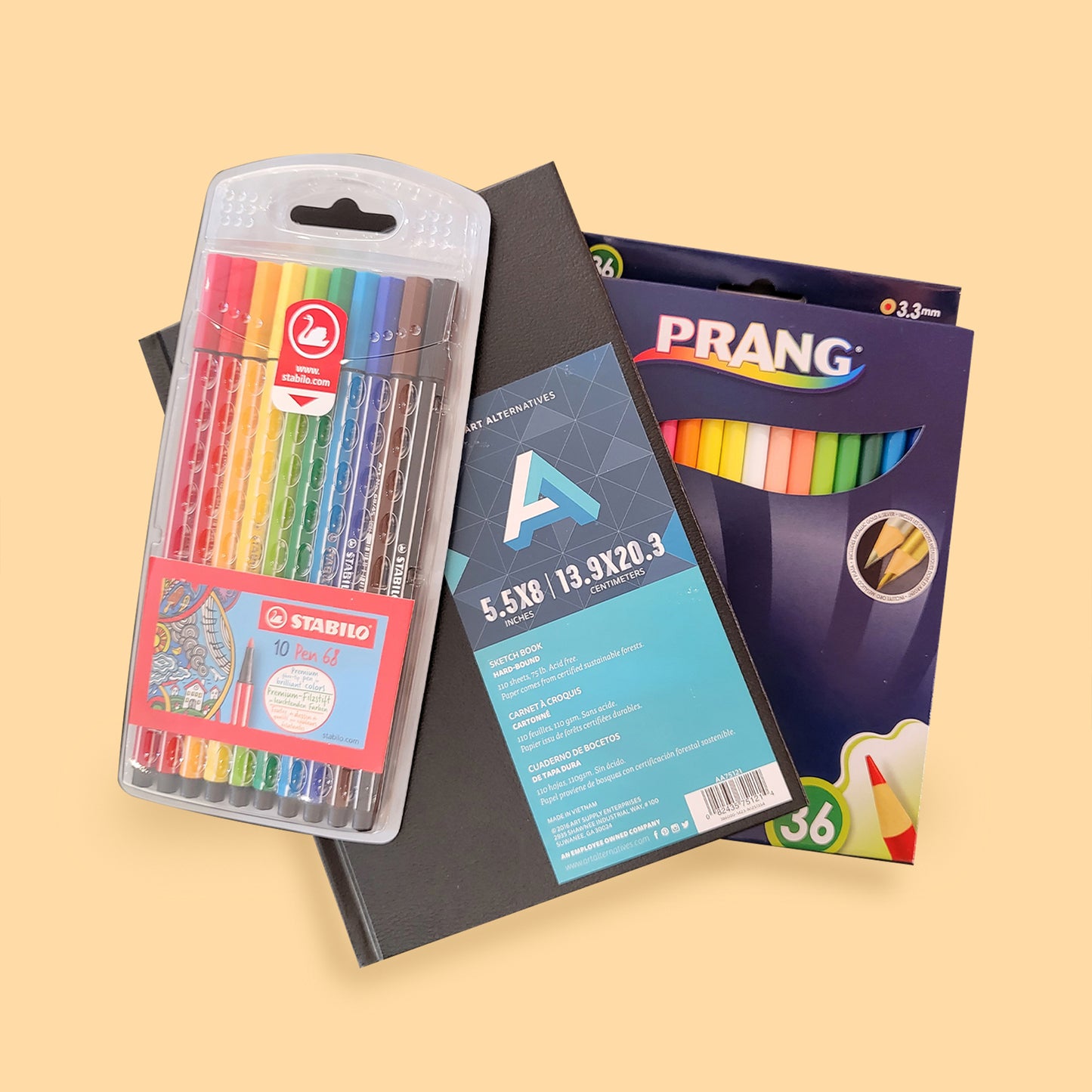 Stacked Prang colored pencil set, art alternative sketchbook and stabilo pen markers