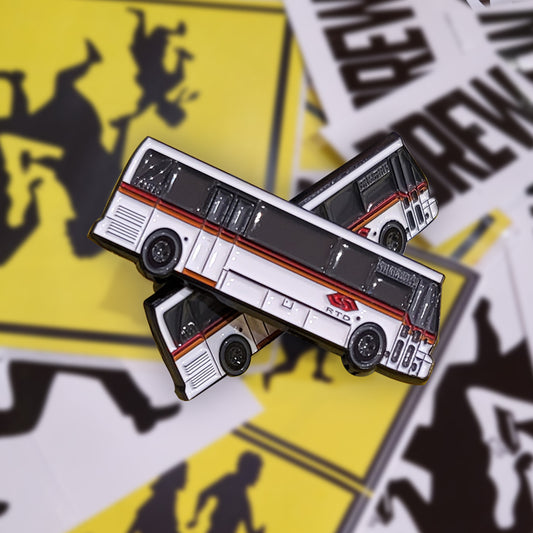 Drew "city bus" metal pin .drew stickers in the background