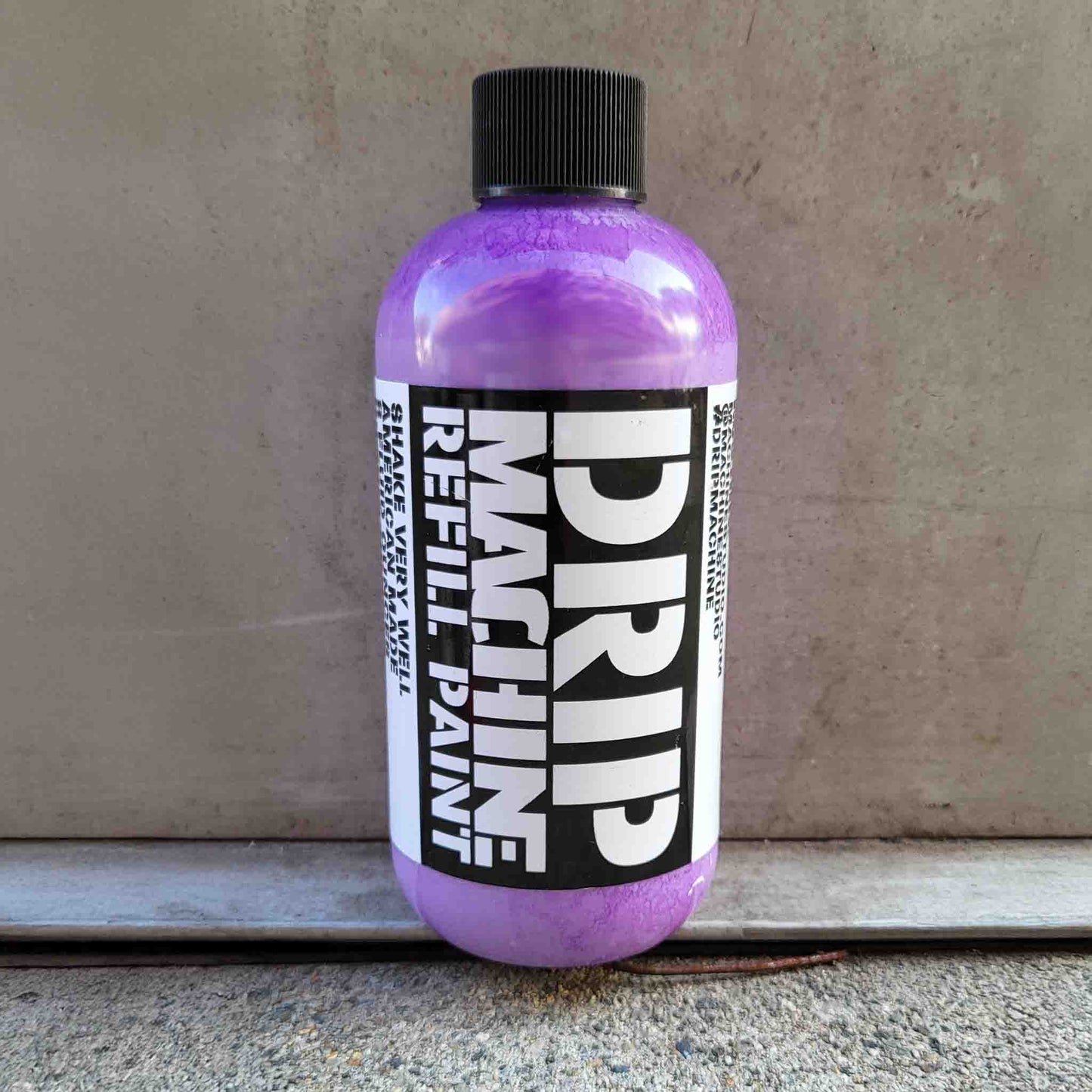 Purple bottle of Drip Machine Refill Paint
