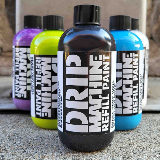 Bottles of Drip Machine Refill Paint in various colors.