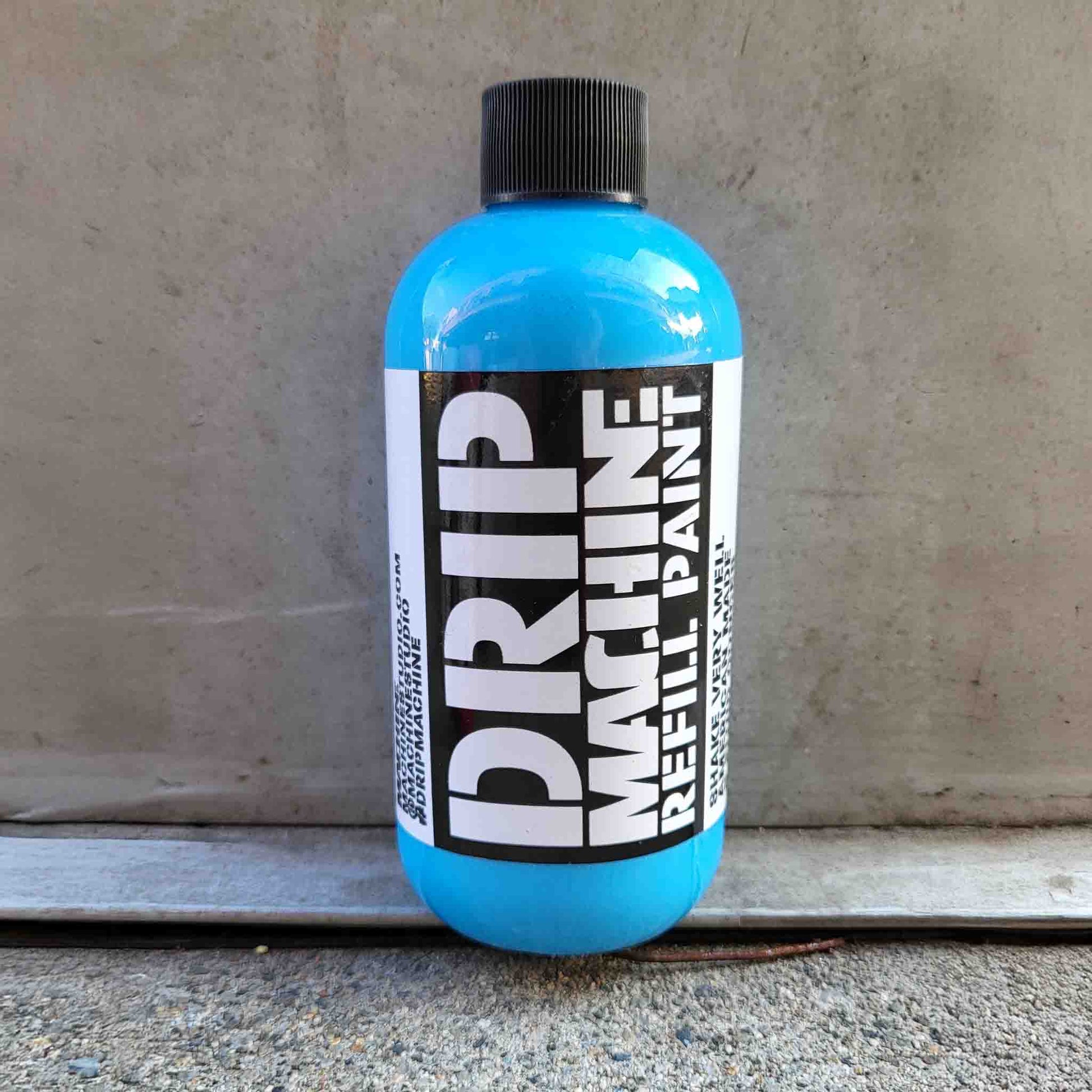 Blue bottle of Drip Machine Refill Paint in blue.