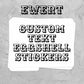 A stack of white stickers with the word 'EWERT' in a black western-style font, shown on a textured gray background with the text 'CUSTOM TEXT EGGSHELL STICKERS' above it.