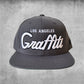 Graffiti the city Los Angeles snap back hat in grey and white.