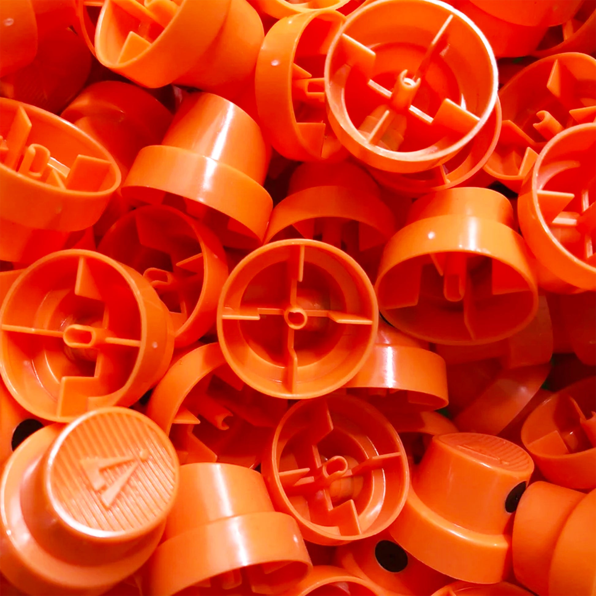 a pile of Hardcore fat spray paint nozzles.