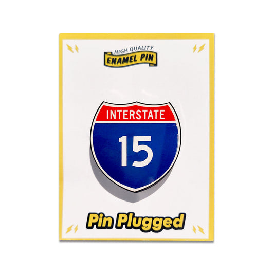 High-quality enamel pin of an interstate 15 sign on a white card with 'Pin Plugged' branding.
