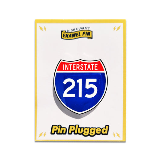 Enamel pin with Interstate 215 design on a white card labeled 'Pin Plugged'.