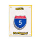 Enamel pin of an interstate 5 sign on a white card with 'Pin Plugged' branding.