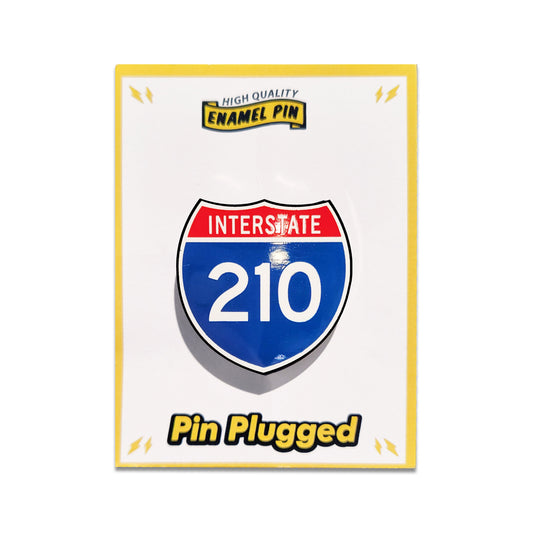 Enamel pin with Interstate 210 design on a white background.
