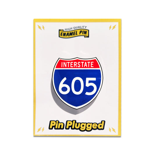 Enamel pin with Interstate 605 design on a white background.