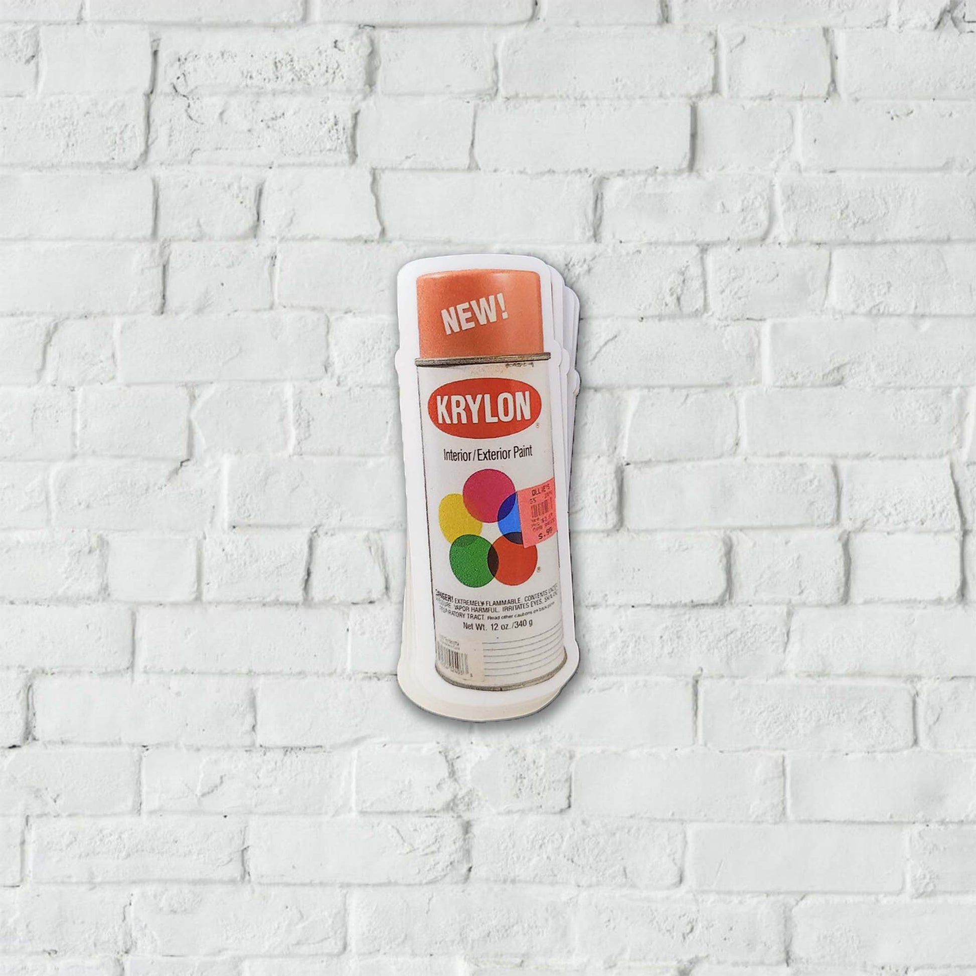 Krylon spray paint can stickerwith an orange color cap.