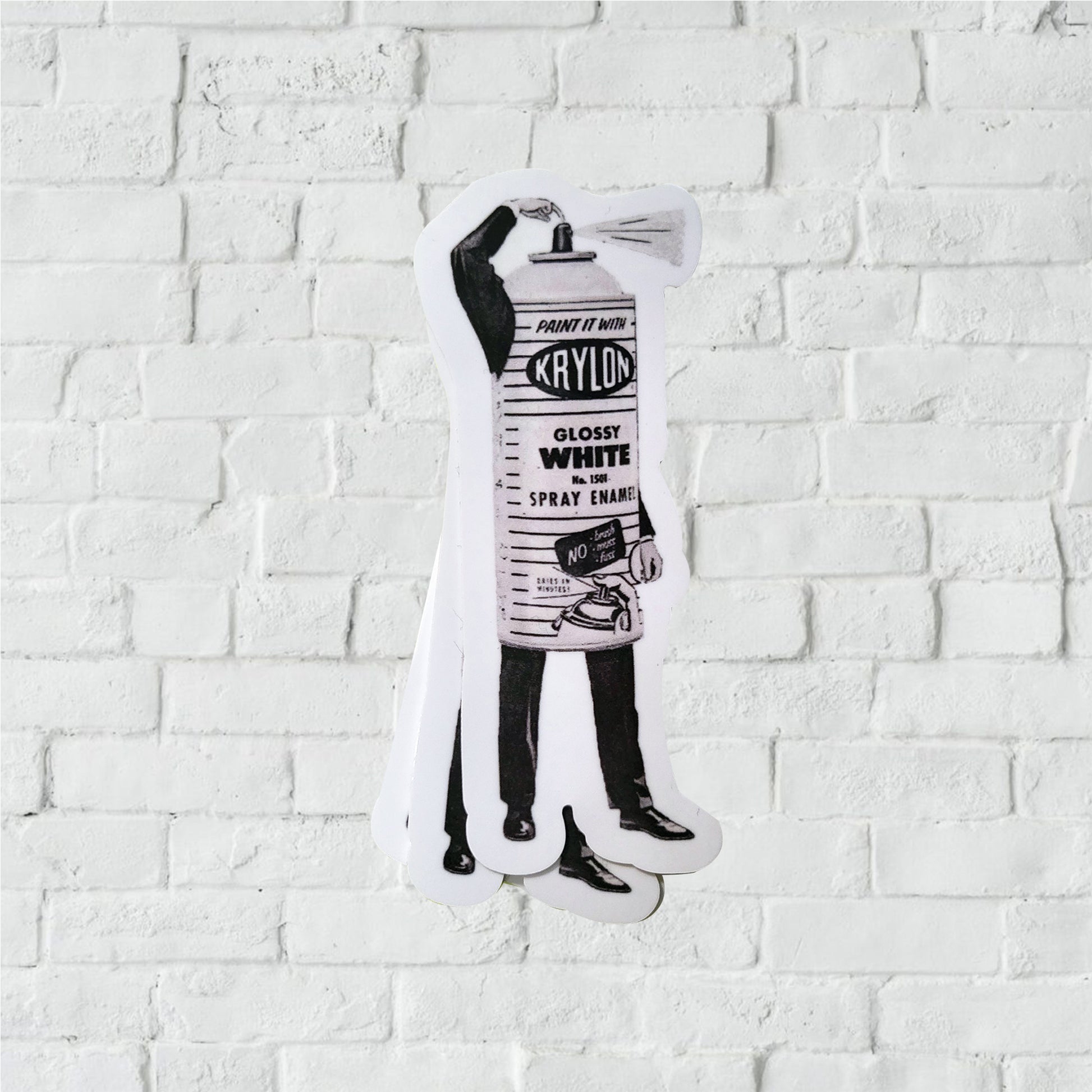 Black and white illustration of a Krylon spray paint can mascot with arms and legs.