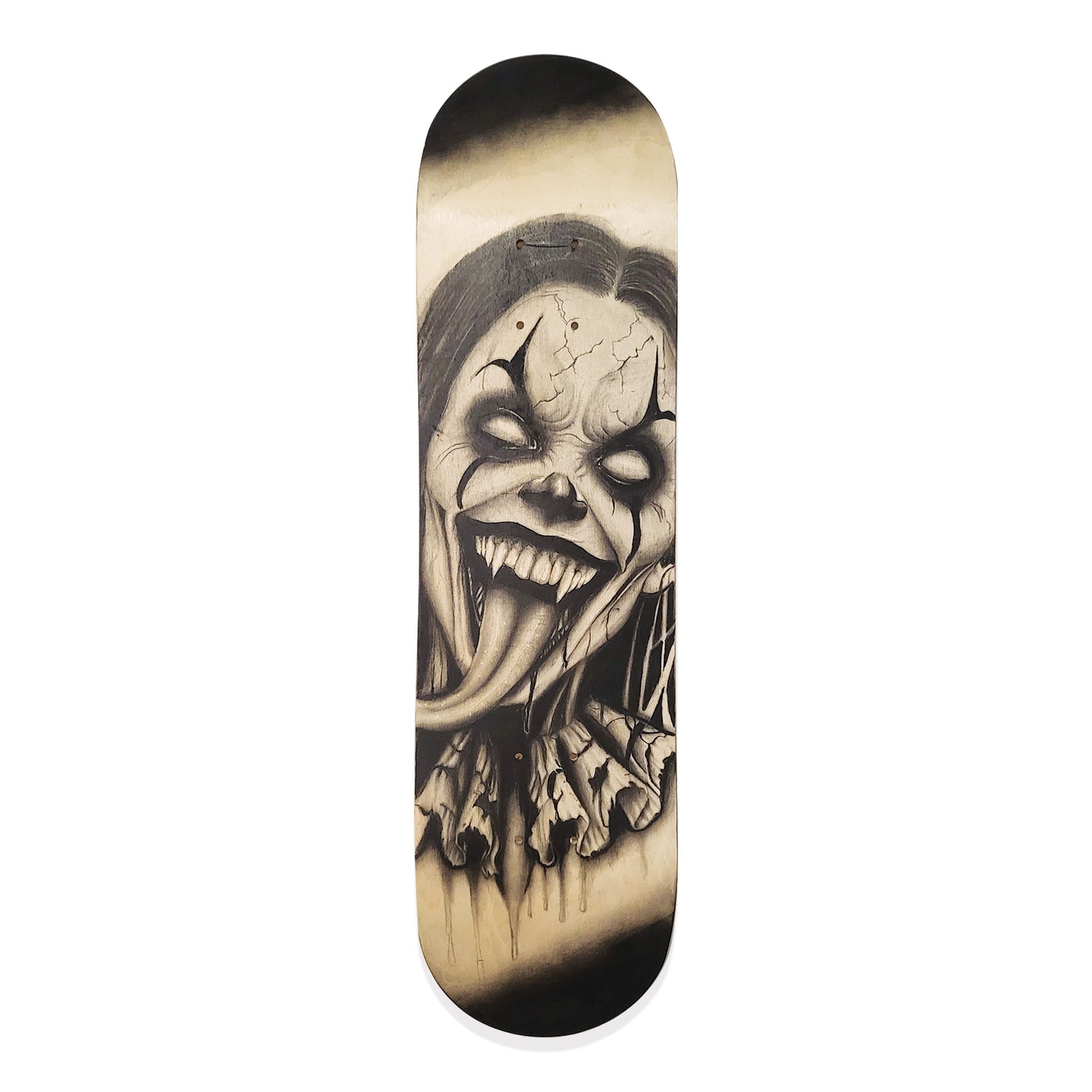 Skateboard deck with a black and white horror clown drawing.