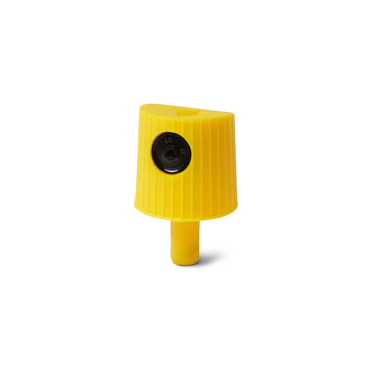 yellow lego cap with a black dot on a white background