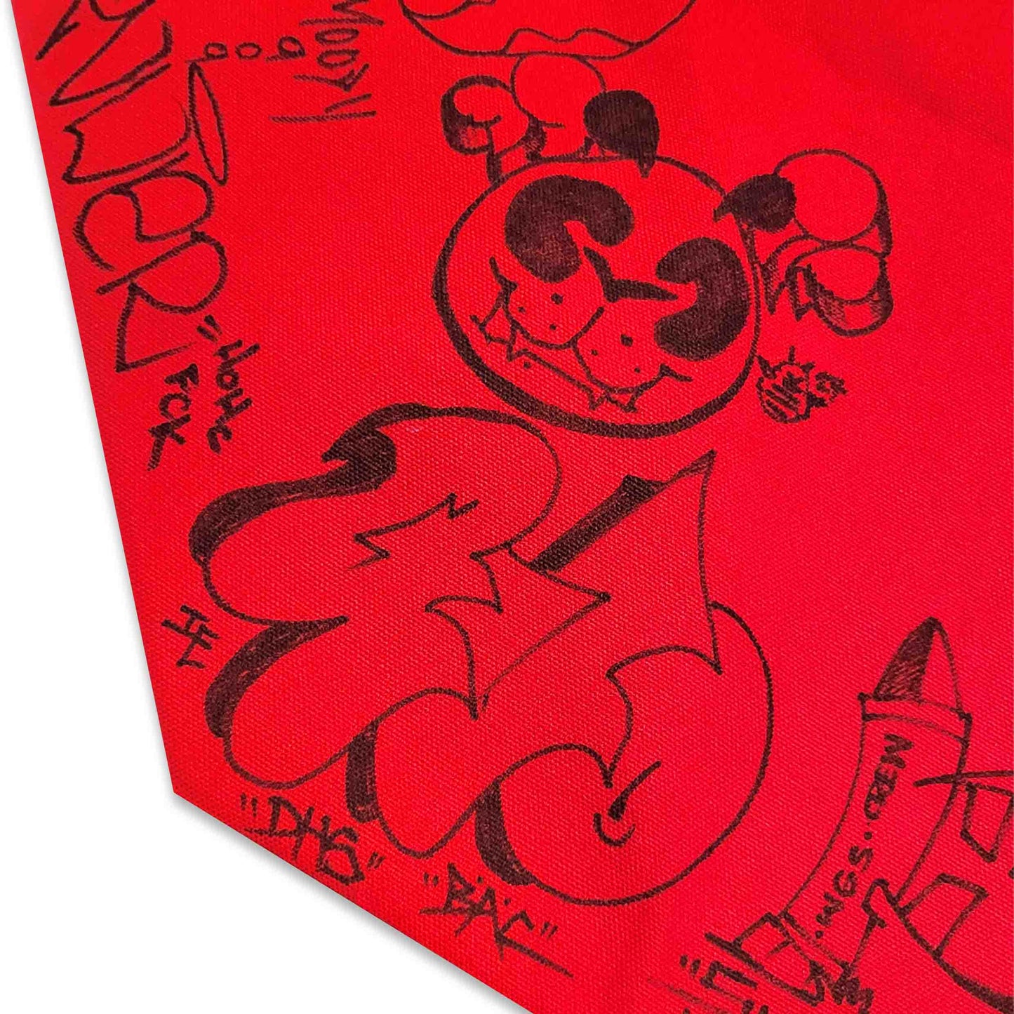 Bight red canvas fabric with various graffiti style writings in black.