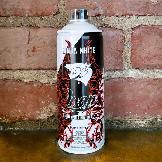 Ninja White Loop Colors Pro aerosol paint made in Italy on brick background
