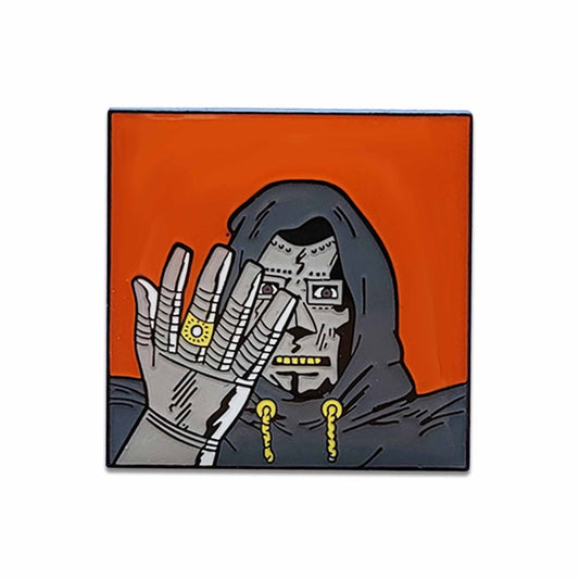 Orange and grey hooded character with metal mask and glove pin