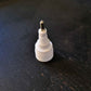 One white plastic and metal pen tip on black background