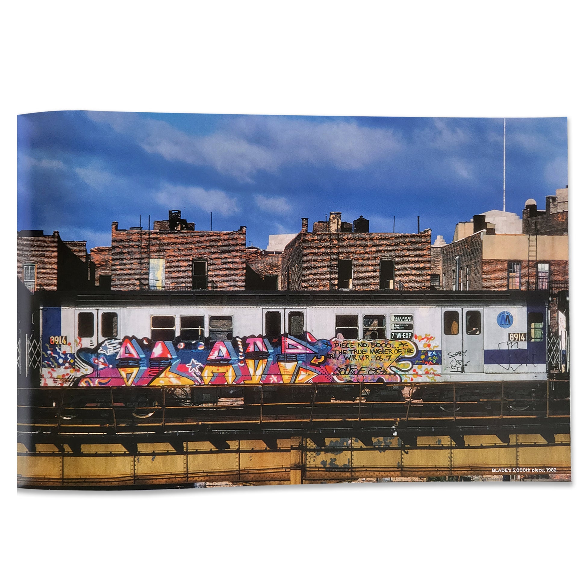 New York 80s colorful graffitied subway train photo.