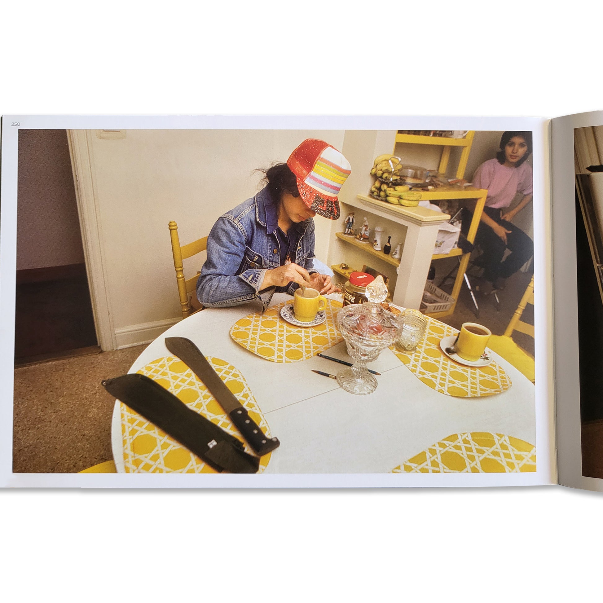 Photo of graffiti artist Lady Pink in her kitchen.