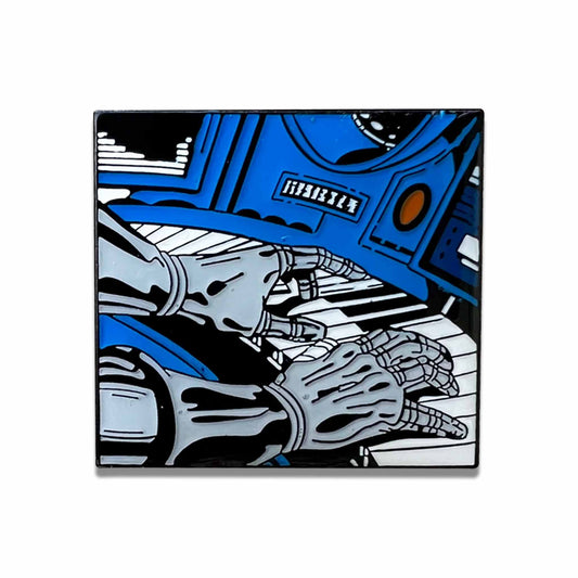 design of Hip Hop artist MF DOOM 's metal hands playing the piano on a metal collectors pin.