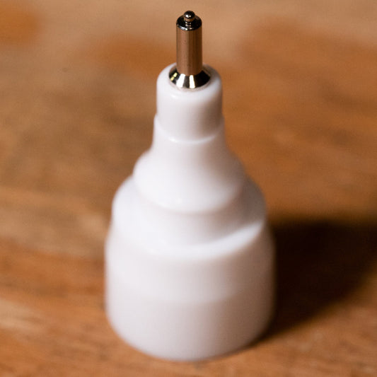 metal machine nib .white plastic base with a metal tip
