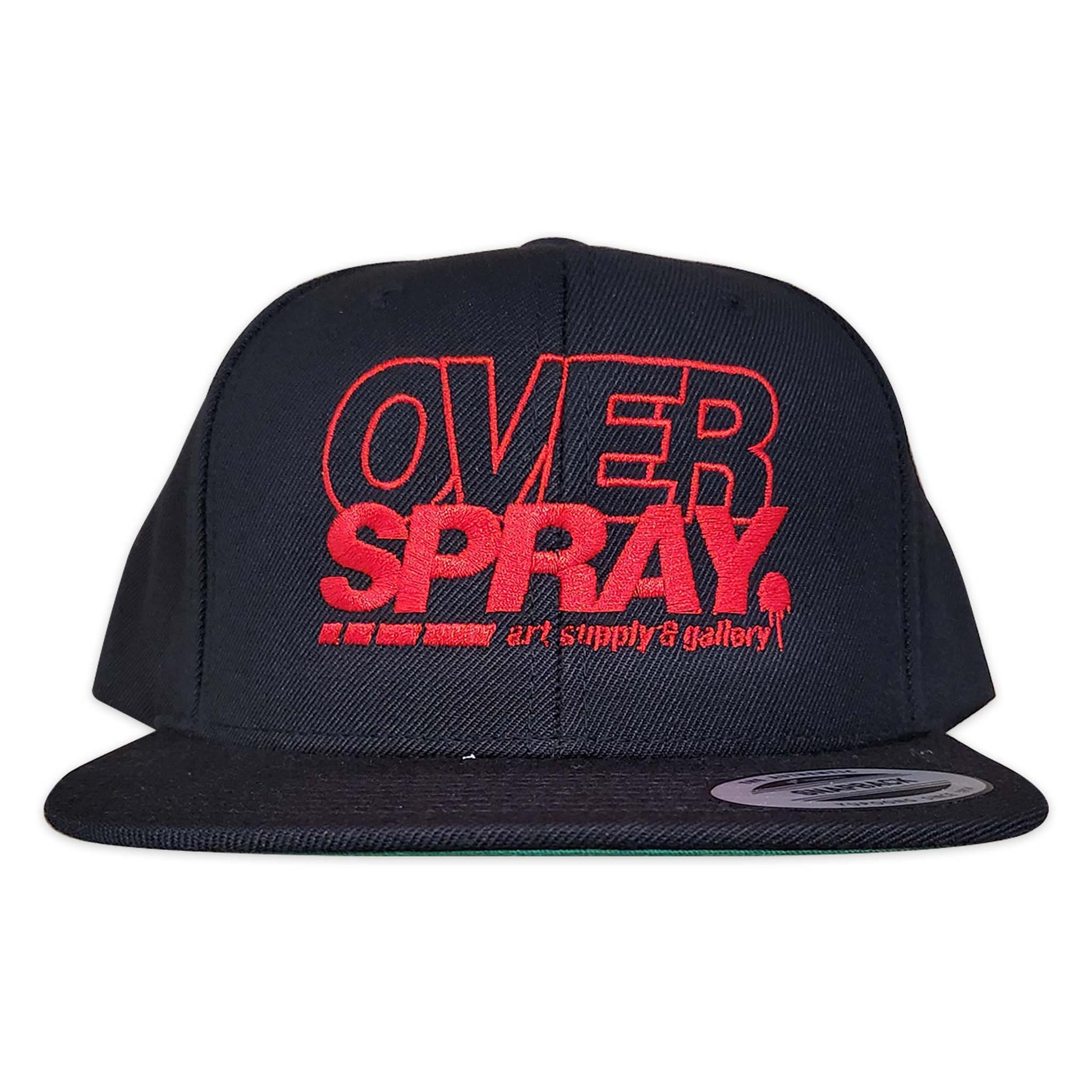 Black cap with red 'OVER SPRAY' text on a white background.