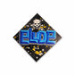Diamond-shaped sticker with 'ELUDE' text and skull design on a black background with colorful specks.