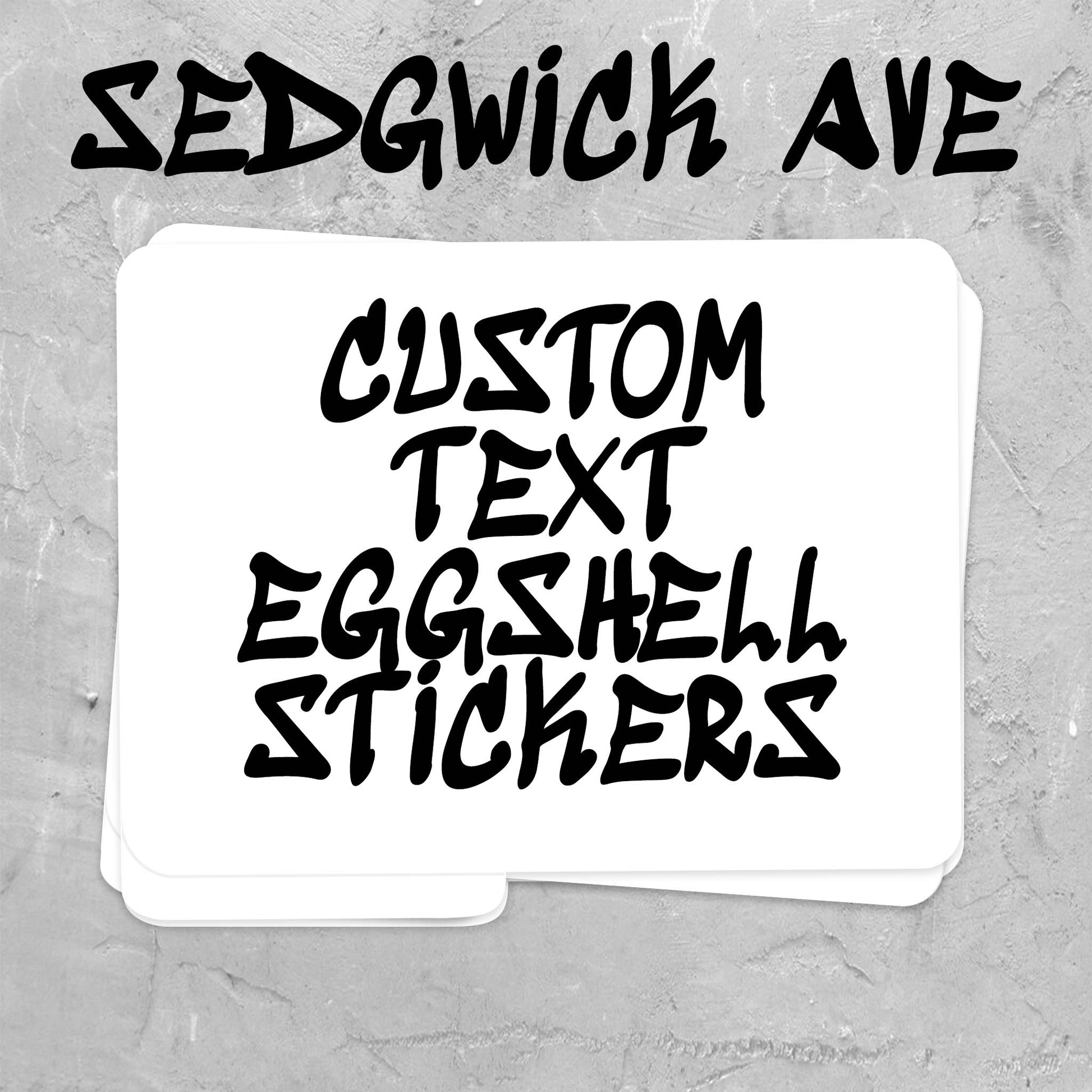 A stack of white stickers with black hand-drawn style text reading 'CUSTOM TEXT EGGSHELL STICKERS' on a gray textured background, with 'SEDGWICK AVE' written above.