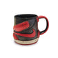 Black and red Nike shoe-shaped mug on a white background.