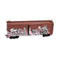 A brown miniature train boxcar with graffiti style painting ont he side.