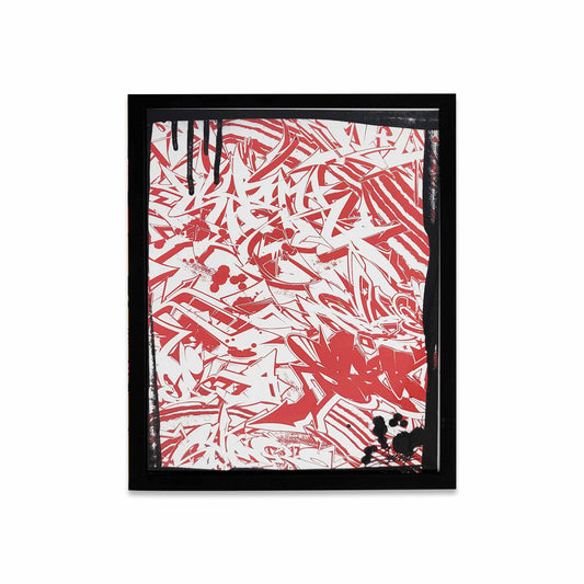 A red and white graffiti style painting with black paint splatters in a black frame.