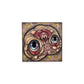 Decorative wall art with a stylized face design on a white background.
