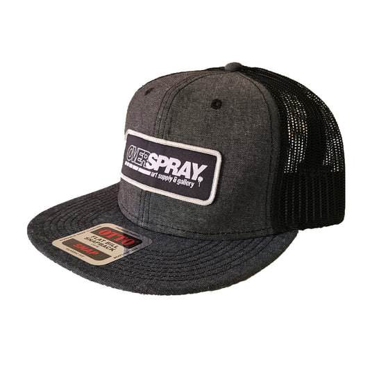 black and grey mesh cap with a black and silver overspray icon patch