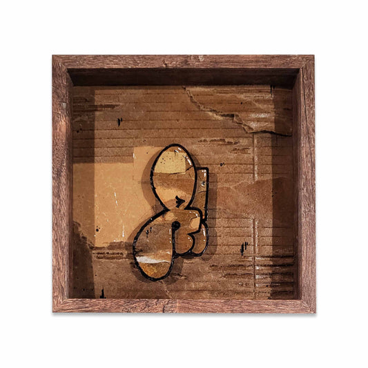 Wooden framed cardboard collage with a graffiti bubble style letter.