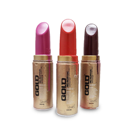 Three Montana Cans brand spray paint GOLD sculpture in the shape of lipsticks.