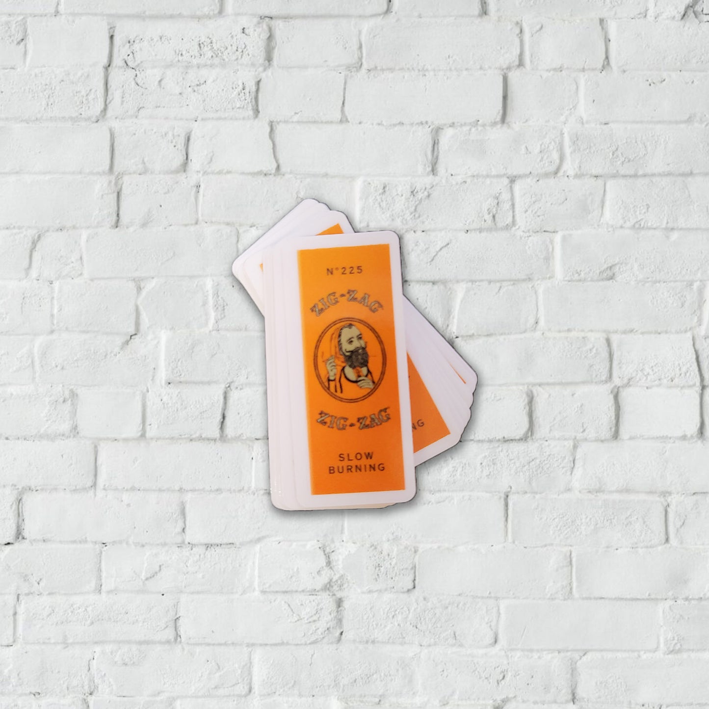 Orange and white stickers of the Zig-Zag slow burning paper labels.