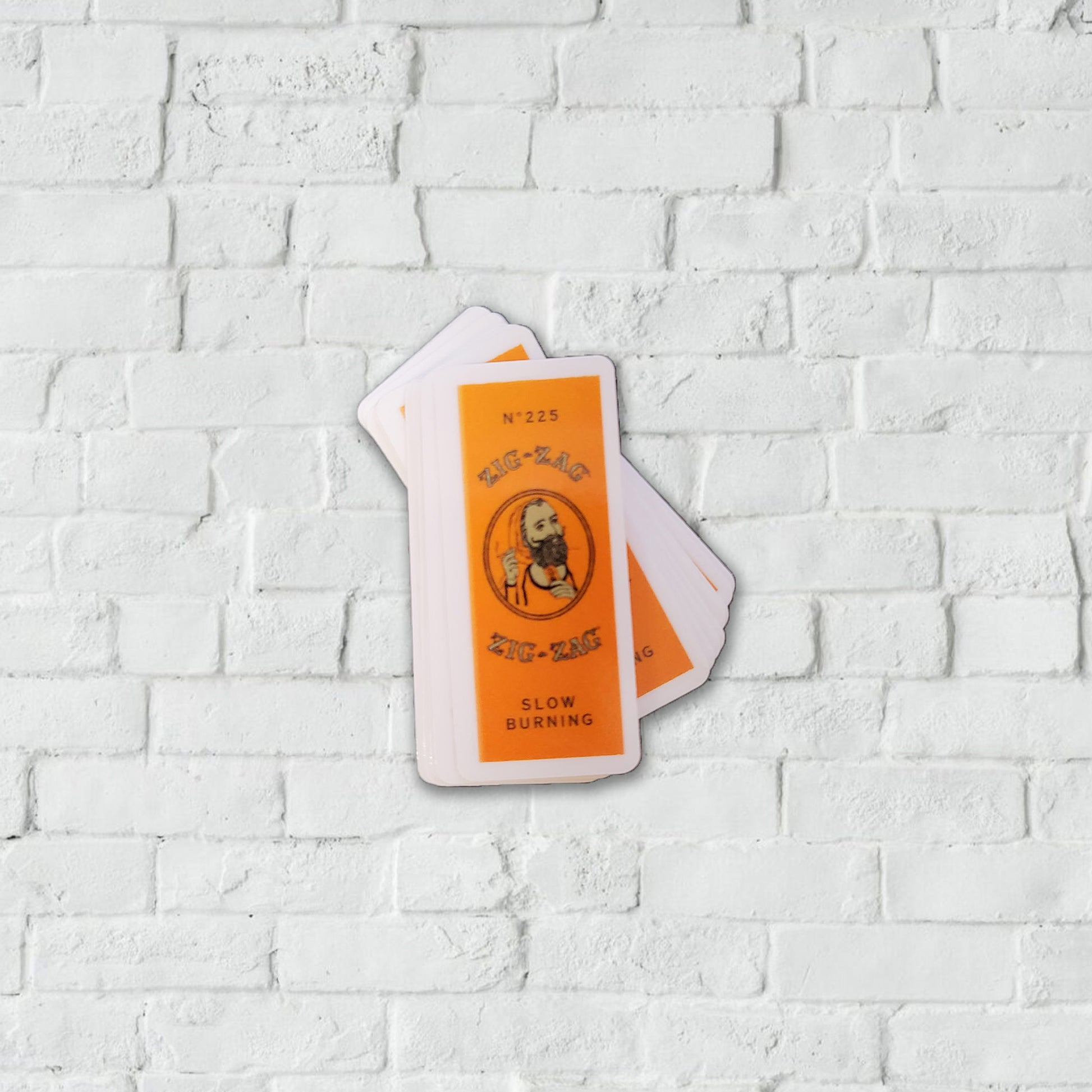 Orange and white stickers of the Zig-Zag slow burning paper labels.