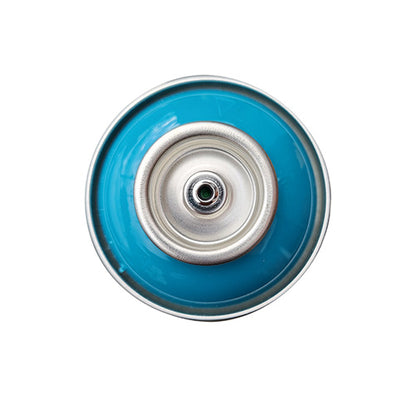 The top of a spray paint can, with a medium teal color swatch in the middle of the silover, metal rings of the can.